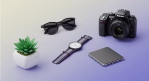 Modern product photography setup with camera, watch, sunglasses, and tech gadget on gradient background